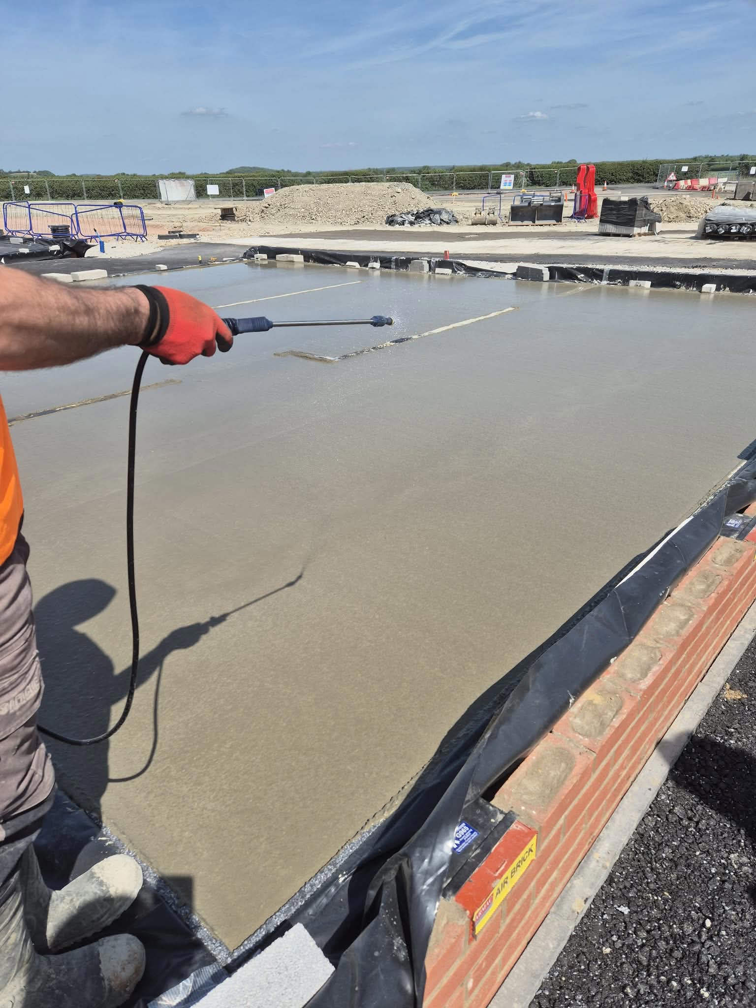 Concrete slab being power floated on a construction site